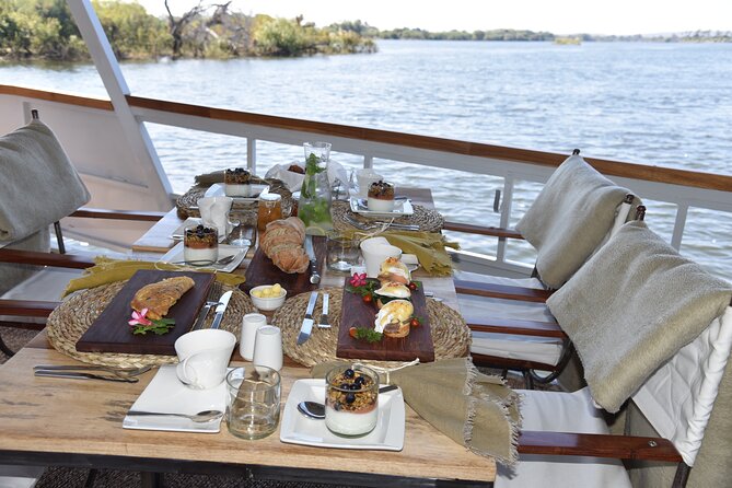 Sunrise Cruise on the Zambezi River - Breakfast with croissants, fruit, and hot coffee