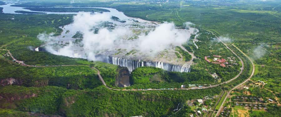 Sunrise Tour Of Victoria Falls-Scenic Water Falls Experience - Entering the rainforest and meeting the falls
