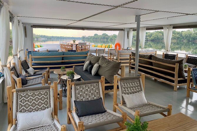 Sunset Cruise on the Zambezi River - Victoria Falls mist in the distance