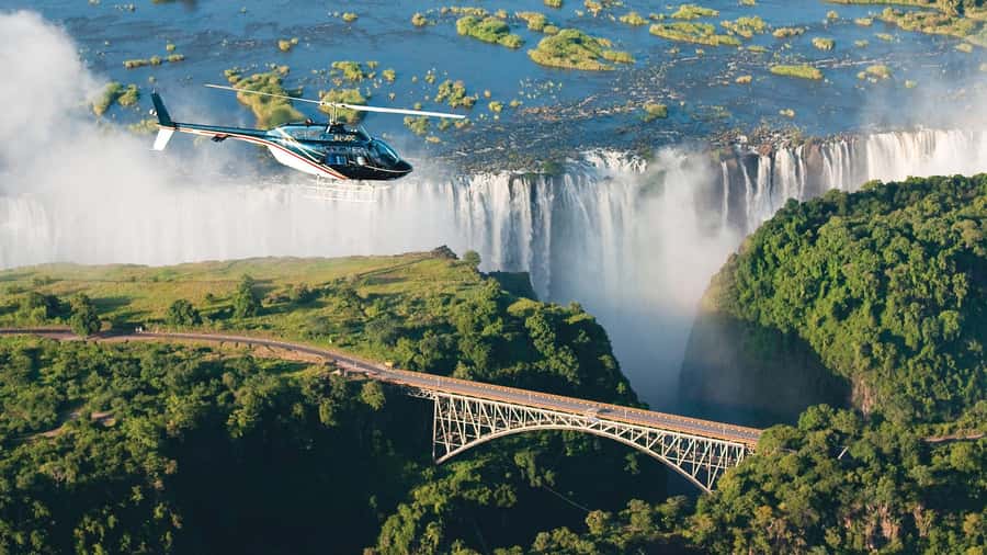 Victoria Falls Guided Tour Zimbabwe & Zambia From Both Sides - Crossing Victoria Falls Bridge